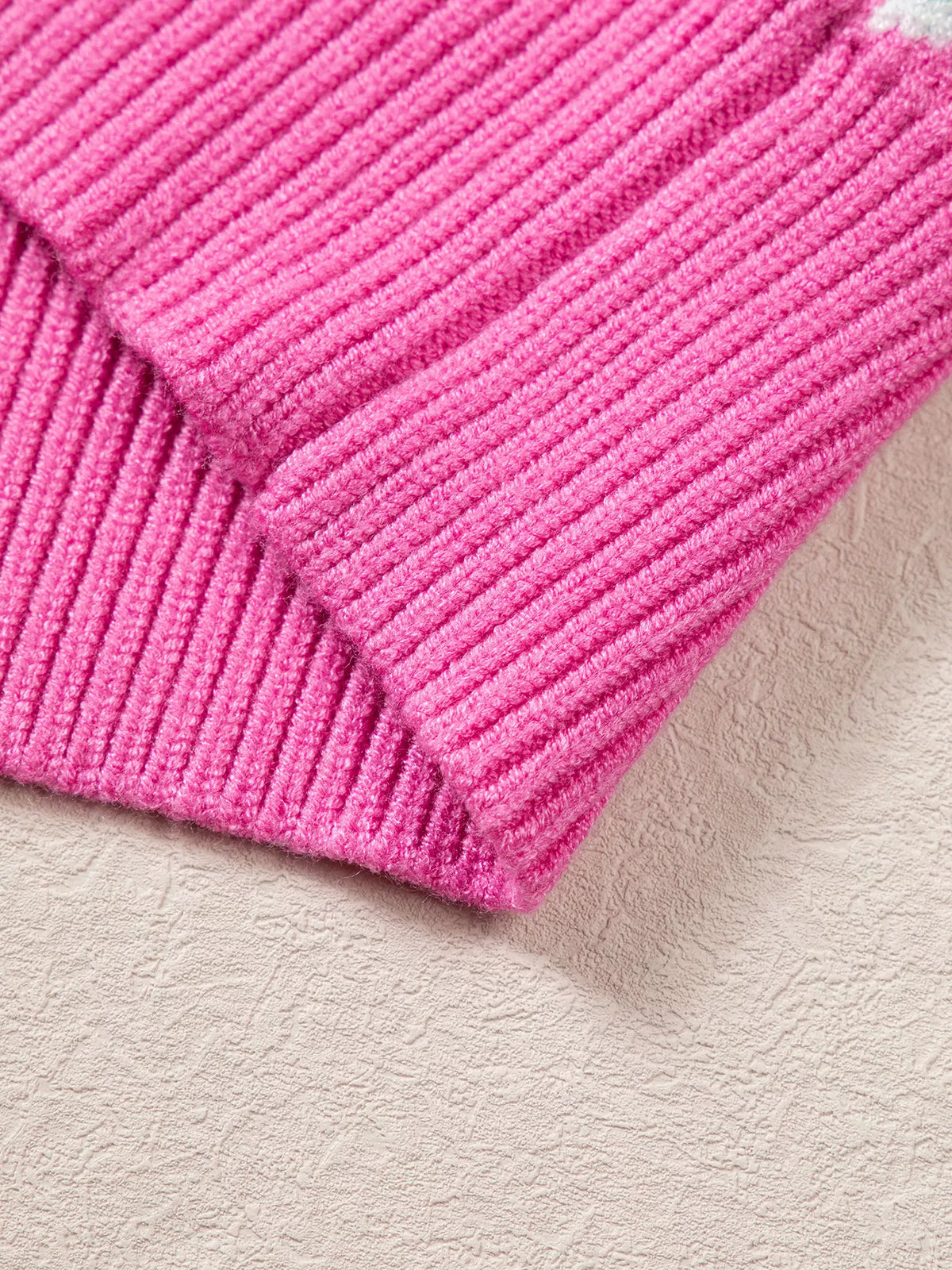 View 8 of the round-neck holiday knit sweater with a graphic across the chest.