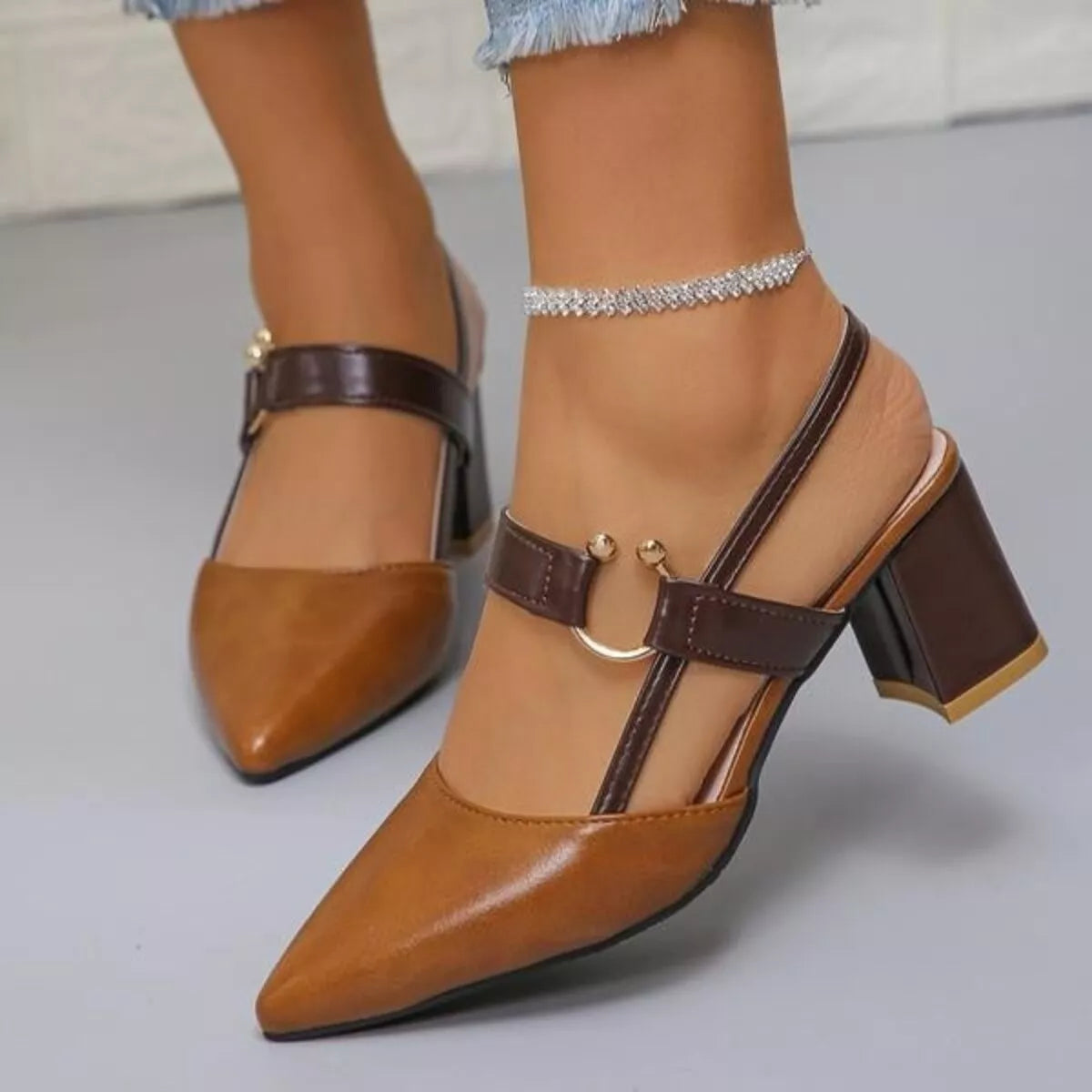 Pointed-toe sandals with a mid block heel.