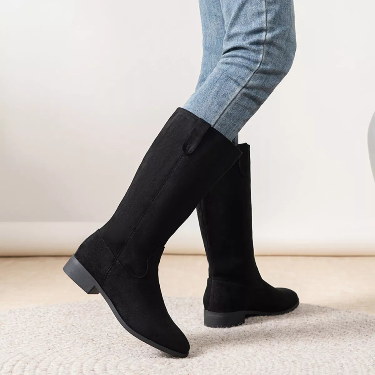 View 2 of the suede pull-on boots with a round toe and a mid heel.