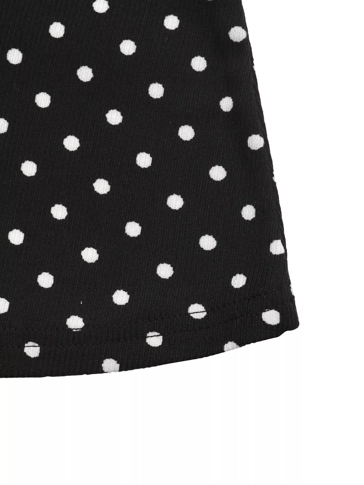 View 10 of the black long-sleeve polka-dot mini dress with a deep V and ruffled cuffs.