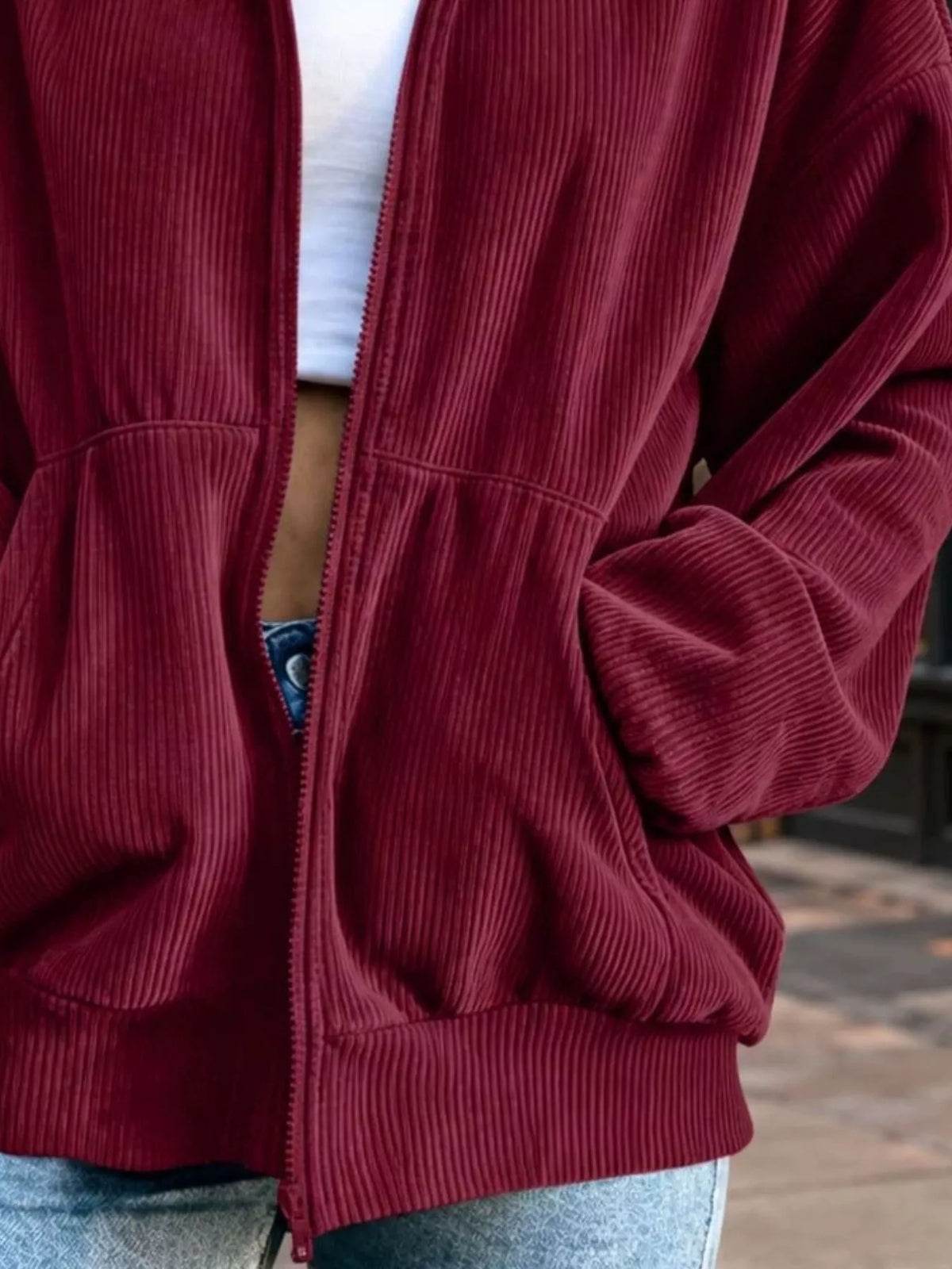 View 6 of the unlined corduroy zip jacket with dropped shoulders and pockets.