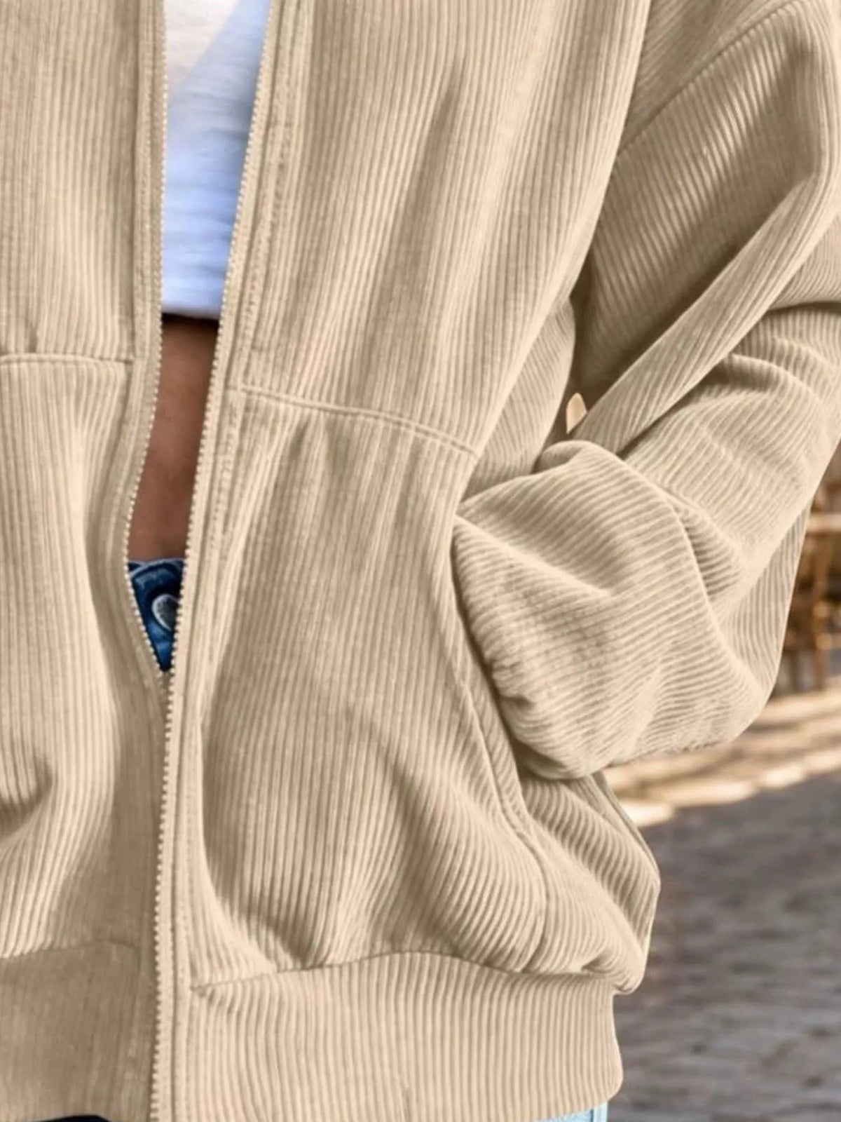 View 12 of the unlined corduroy zip jacket with dropped shoulders and pockets.