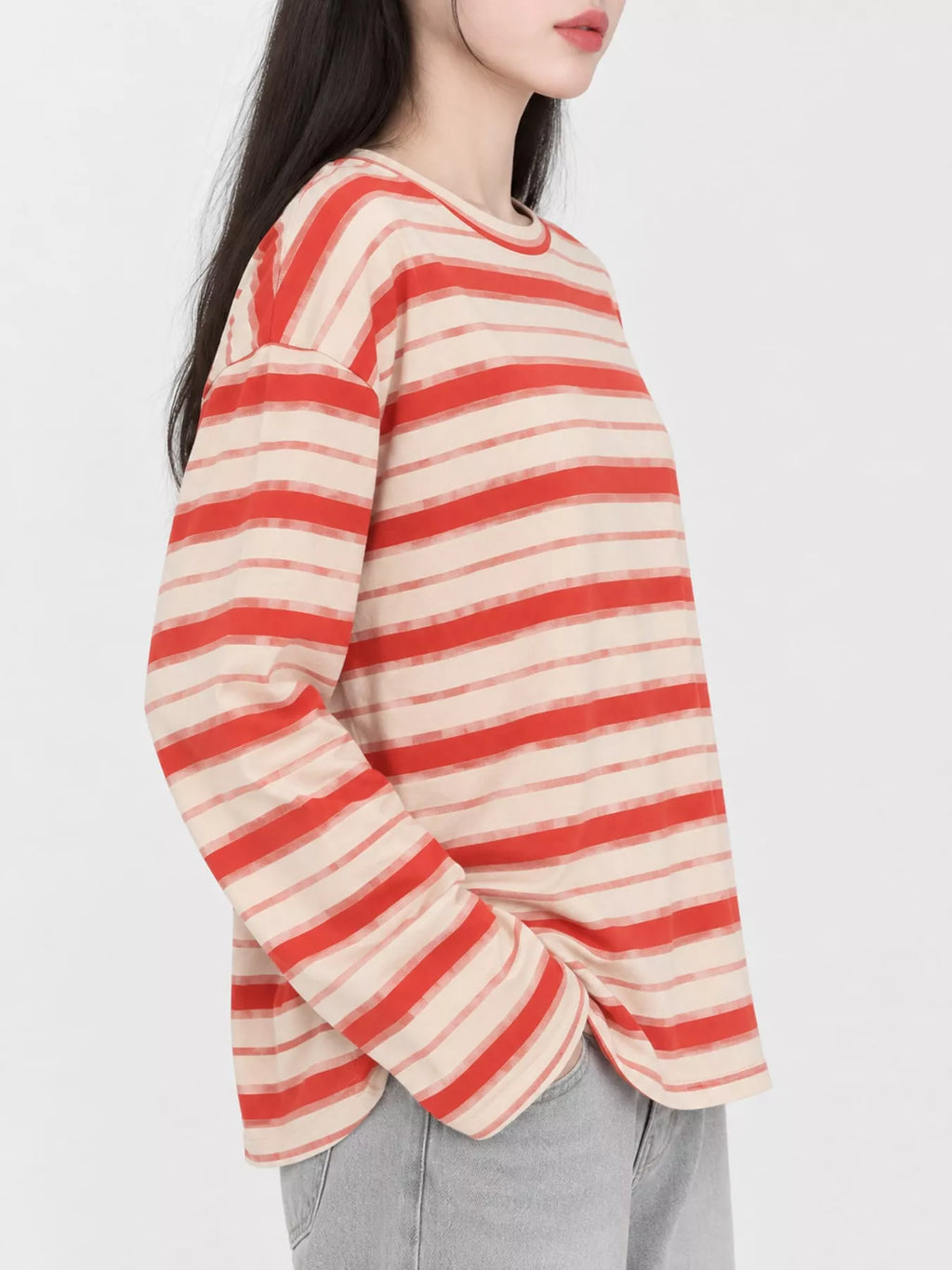 View 15 of the oversized navy-and-cream striped tee with dropped shoulders.