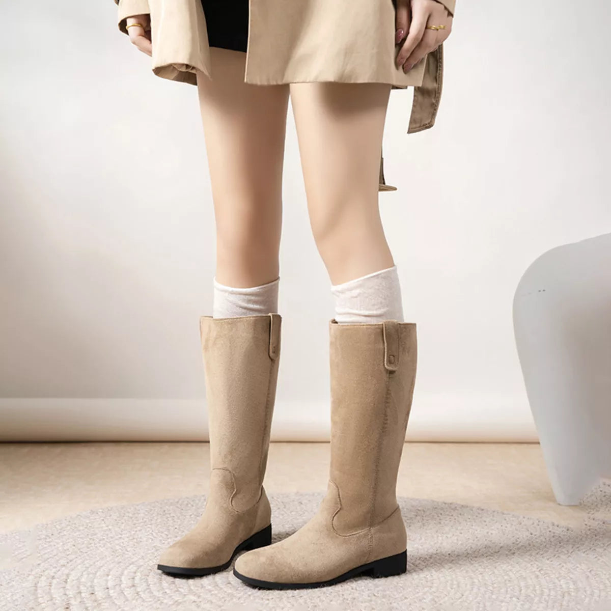 View 5 of the suede pull-on boots with a round toe and a mid heel.