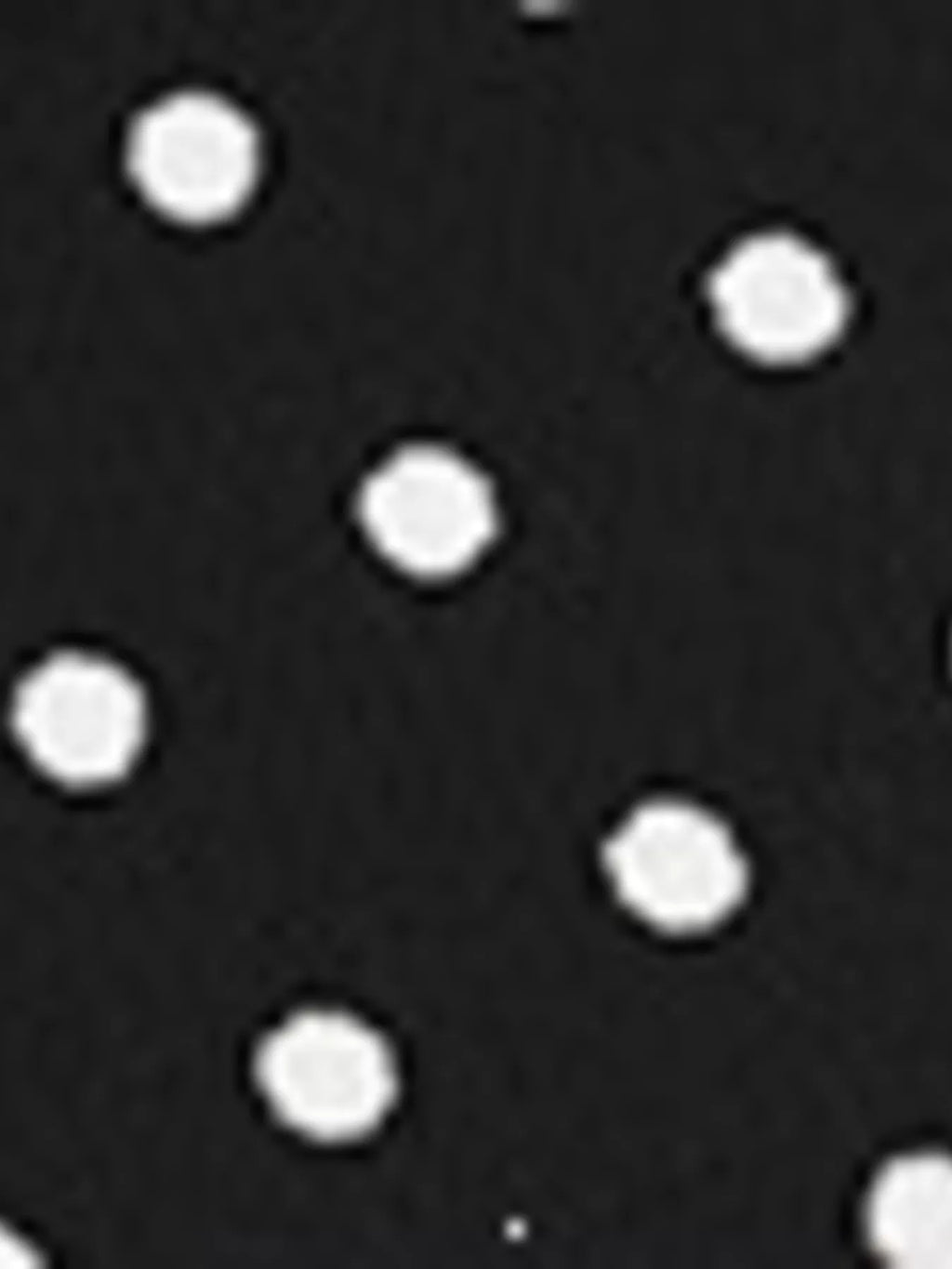 View 9 of the black long-sleeve polka-dot mini dress with a deep V and ruffled cuffs.