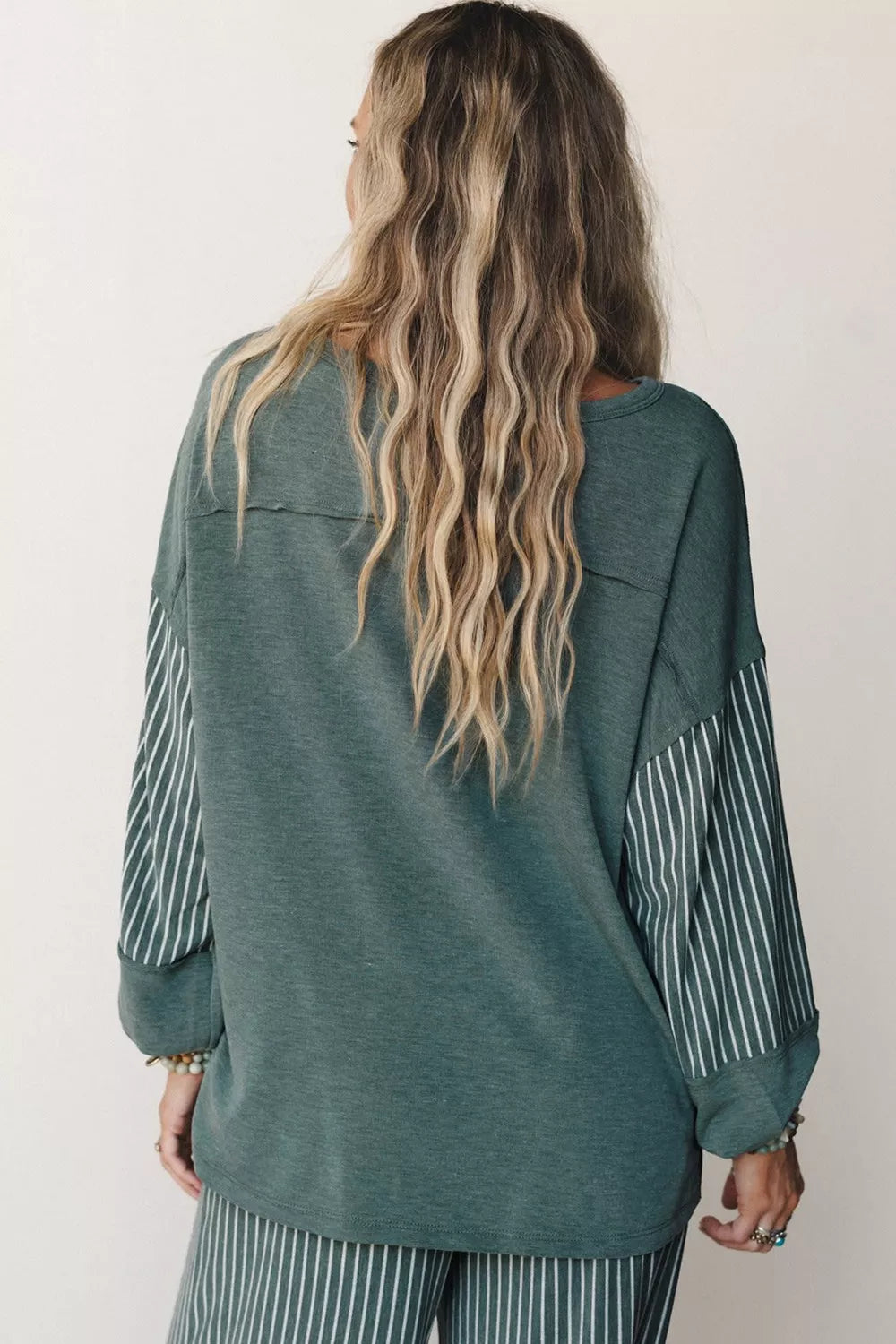 View 7 of the striped two-piece set with a long-sleeve top and drawstring pants.