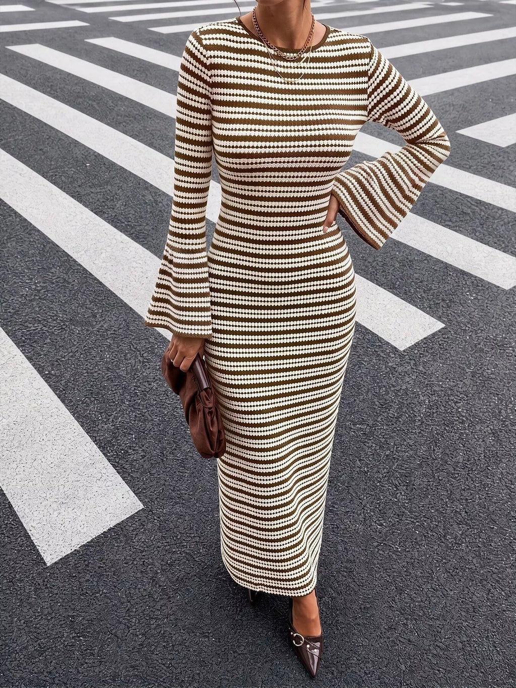 View 2 of the striped ribbed knit dress with flare sleeves.