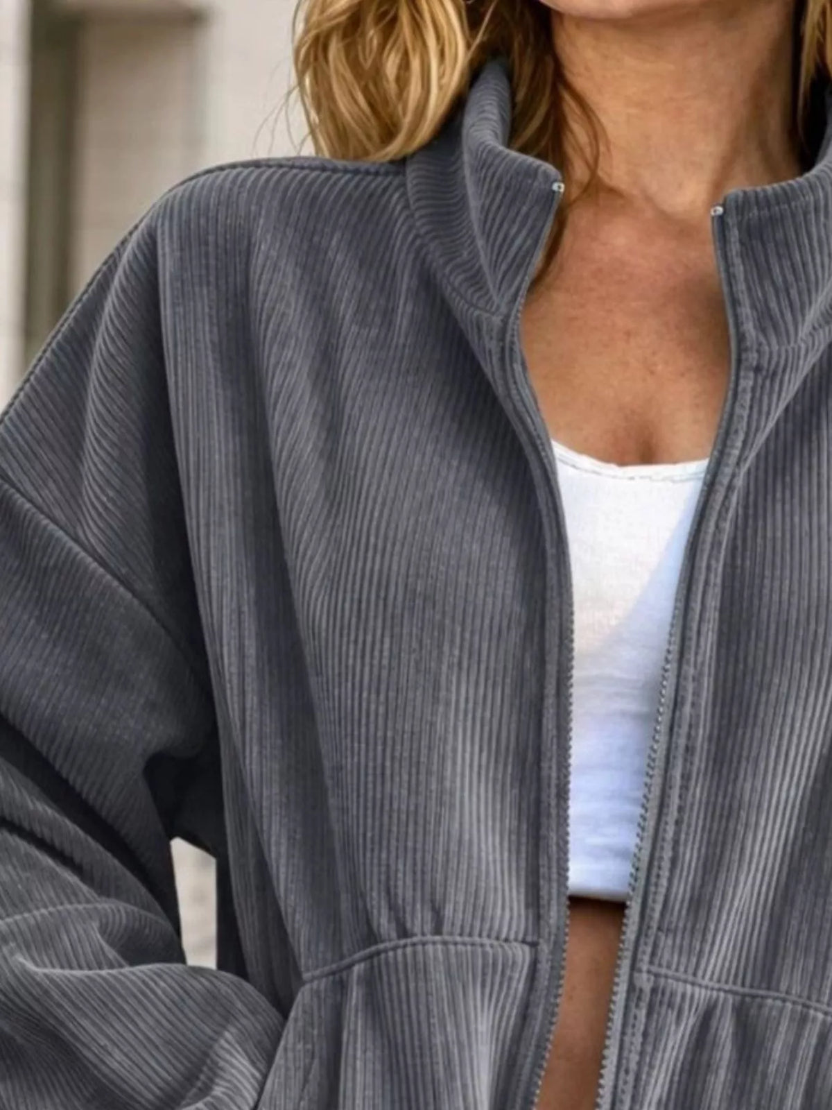 View 8 of the unlined corduroy zip jacket with dropped shoulders and pockets.