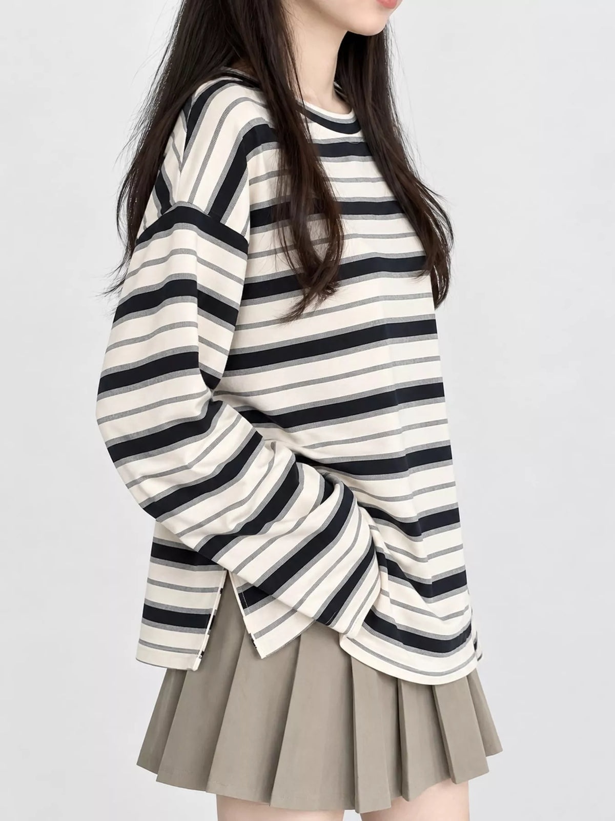View 3 of the oversized navy-and-cream striped tee with dropped shoulders.