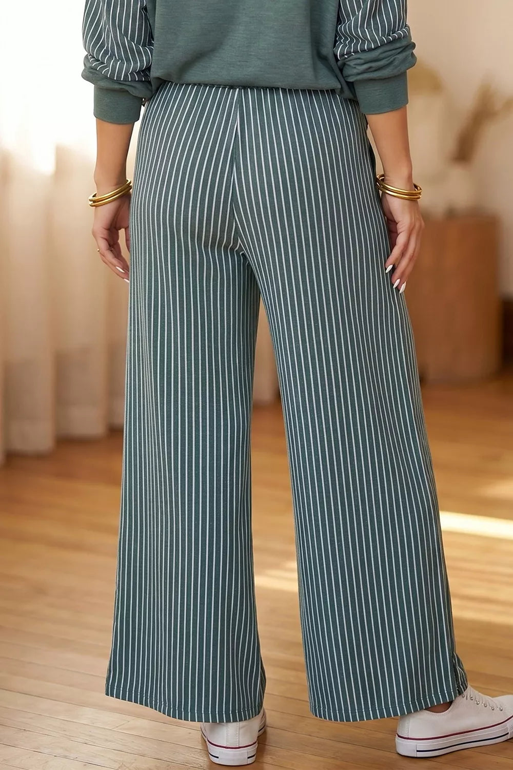 View 3 of the striped two-piece set with a long-sleeve top and drawstring pants.
