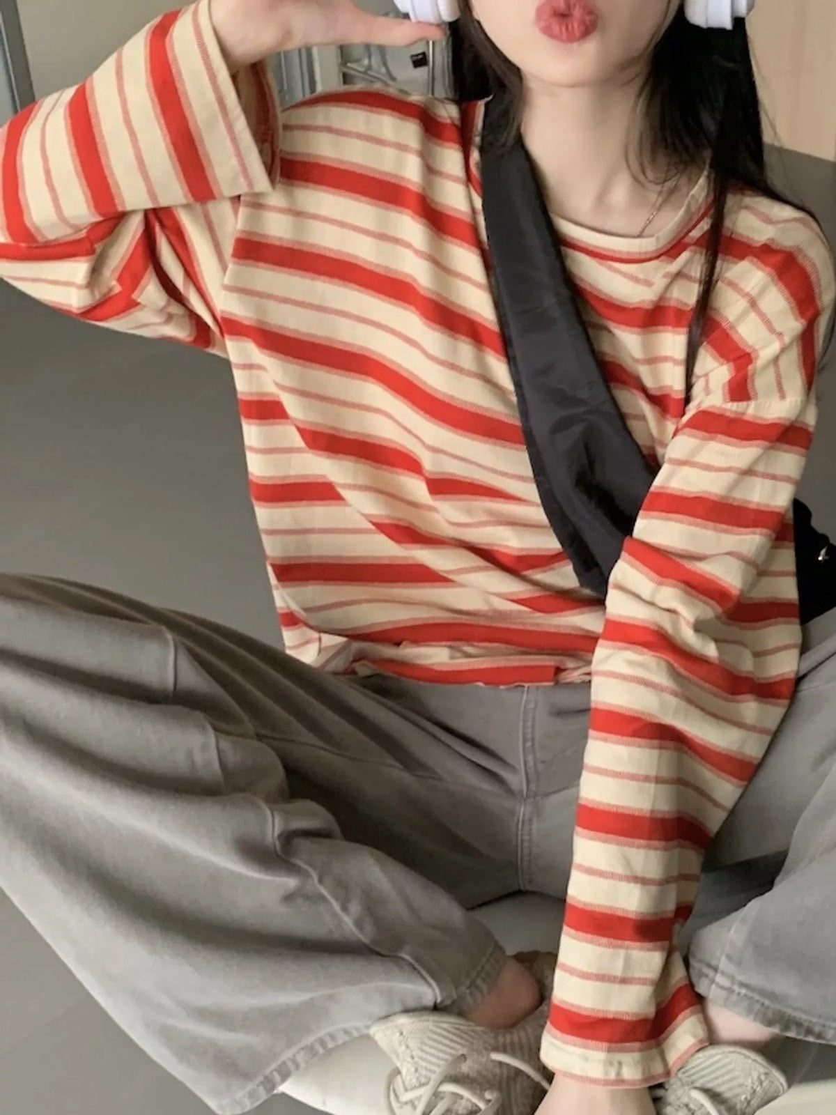 View 21 of the oversized navy-and-cream striped tee with dropped shoulders.