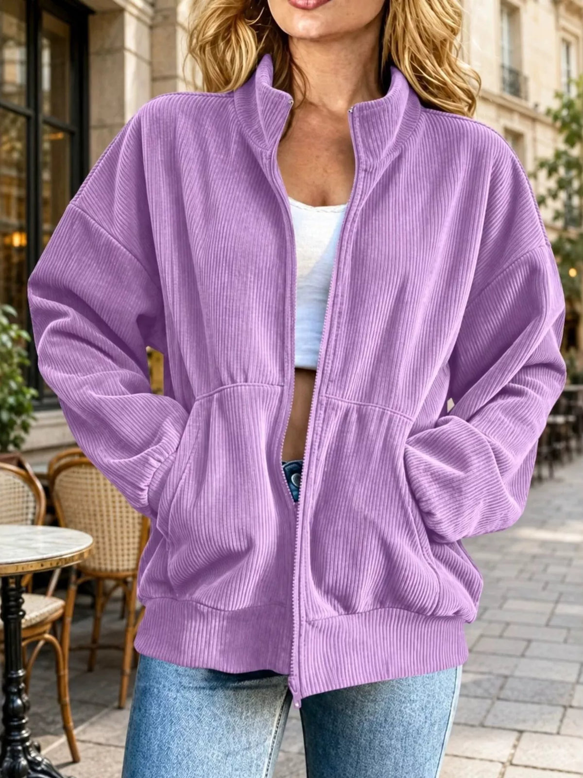 View 13 of the unlined corduroy zip jacket with dropped shoulders and pockets.