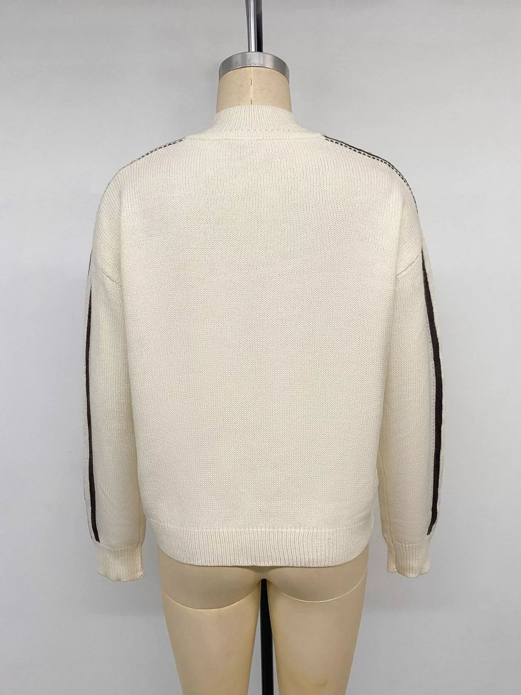 View 14 of the cardigan with Chinese knot buttons and contrast stripes down the sides.