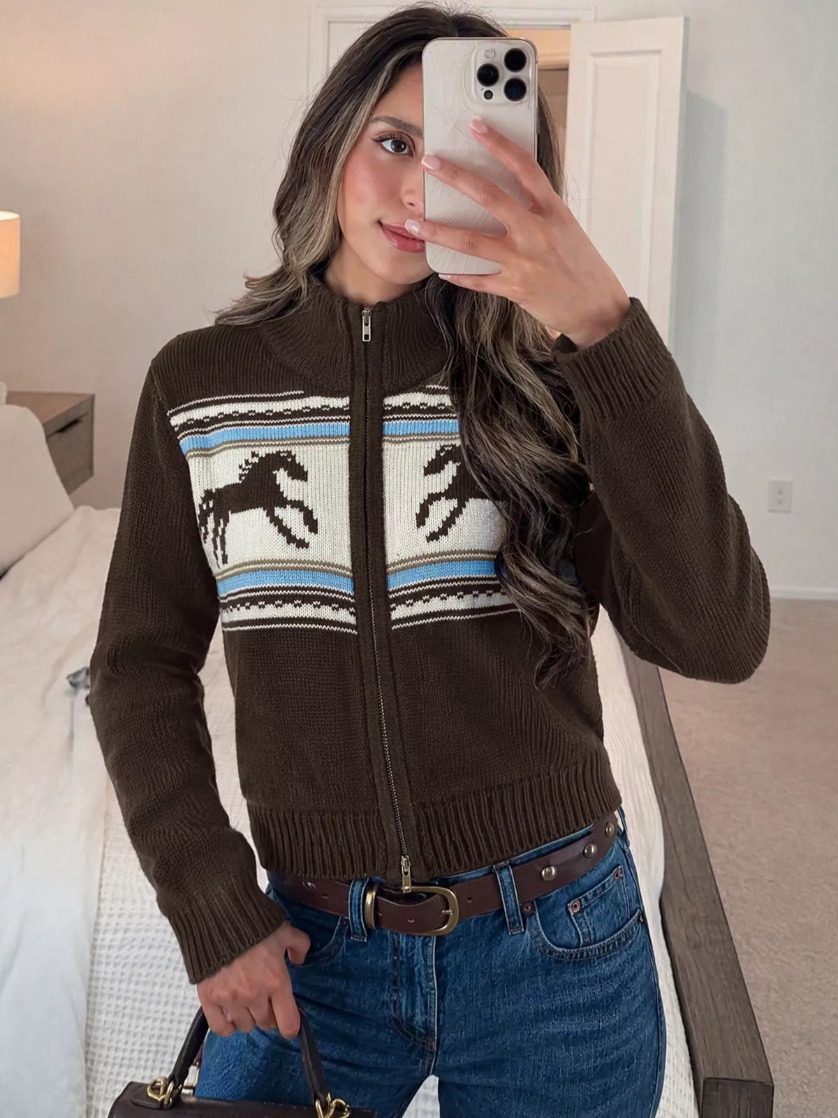 View 4 of the brown zip mock-neck cardigan with black horses on a cream chest band.