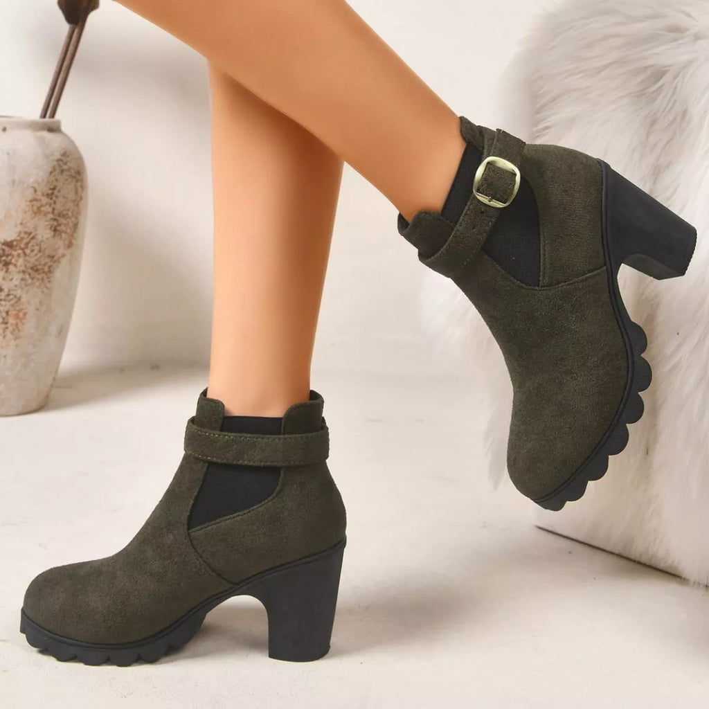 View 7 of the suede boots with a round toe and a high block heel.